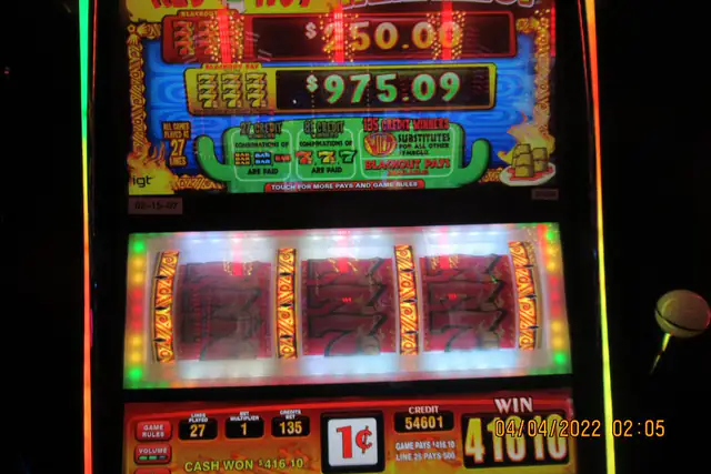 Classic three-reel slot machine with a lit credit meter and win display
