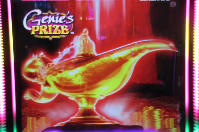 Video slot screen showing a golden genie lamp under a Genie's Prize title